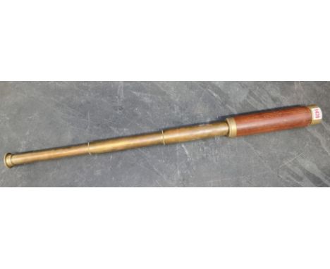 An old brass and teak three drawer telescope, inscribed 'Stanley & Co, London, No.9279', 81cm long.PLEASE NOTE: We have been 