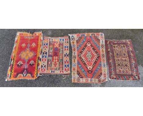 Two Kelim rugs, having Aztec design; together with a Persian rug and one other, largest, 172 x 105cm. (4)