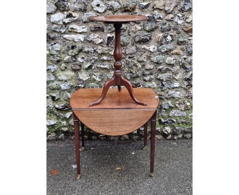 A George III mahogany and line inlaid oval Pembroke table, 91cm wide when open; together with a mahogany circular tilt-top tr