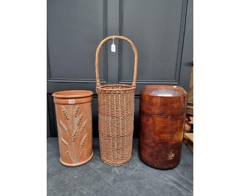 A wicker stick stand, 80cm high; together with another terracotta example; and one other. (3)