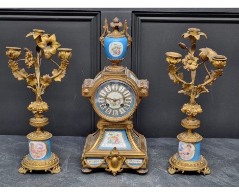 A late 19th century gilt metal and Sevres style mantel clock, 41.5cm high; together with a pair of similar candelabra, 38cm h