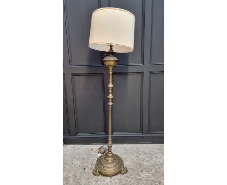 An old brass standard lamp. 
