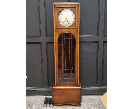 An Art Deco oak longcase clock,&nbsp;191.5cm high, with pendulum and three chrome weights.