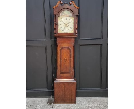 An early 19th century oak and mahogany eight day longcase clock, the 12in arched painted dial inscribed 'P Guarerio, Huntingd