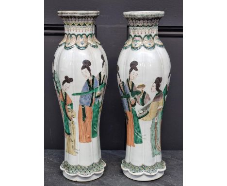 A large pair of Chinese famille vert vases, Qianlong four character marks to base, of hexafoil section with relief moulded ne