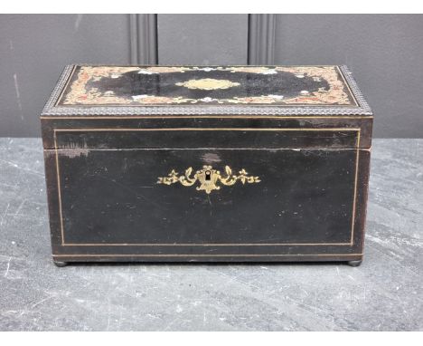 A 19th century French ebonized and inlaid tea caddy, 23.5cm wide.