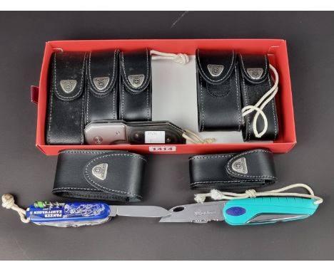 Five Victorinox penknives, to include a 'Mauser' example, each in case; together with a Victorinox Swiss Tool multi-tool, cas