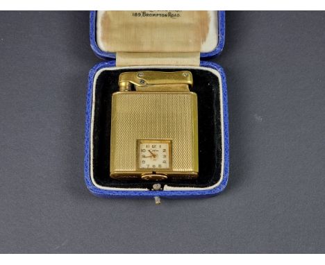 A vintage Colibri Monopol engine turned gilt metal novelty timepiece lighter, 5.5cm high.