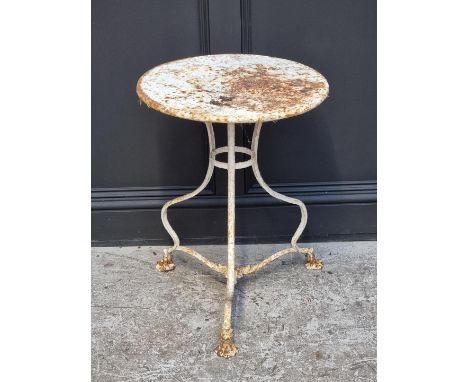 An old white painted wrought iron circular tripod table, 50cm diameter.