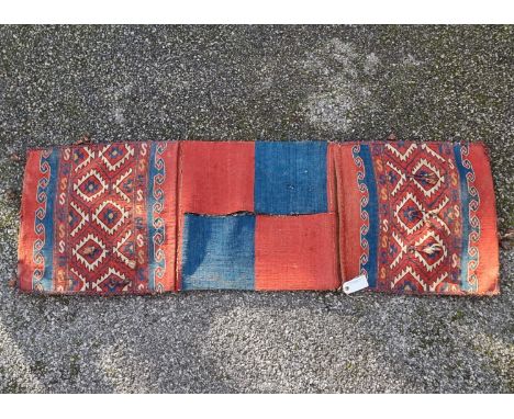 An antique Persian saddle bag; together with a Persian runner, 140 x 50cm. (2)