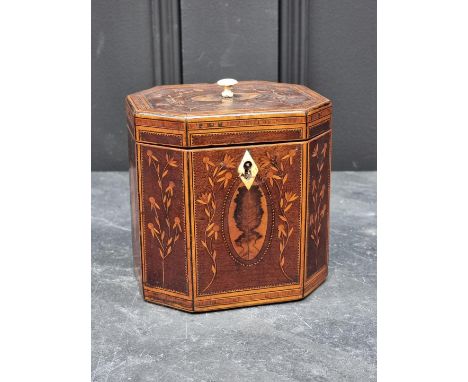 A George III mahogany and inlaid octagonal tea caddy, with bone escutcheon and finial, 12.5cm wide.