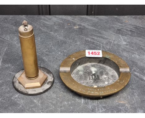 Of Nautical Interest: a bronze ashtray, inscribed 'Metal From R.M.S. Mauretania', 12.5cm diameter; together with a brass tabl