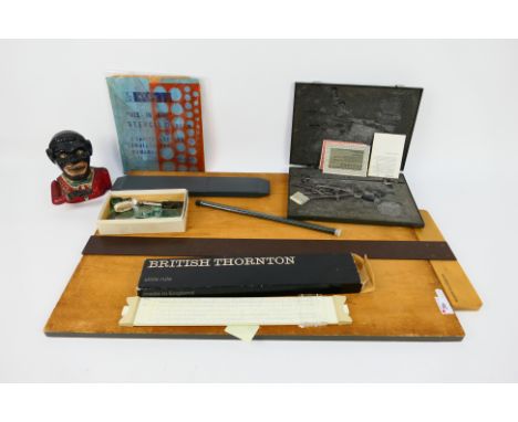 A vintage cast iron money bank and a quantity of draughtman's items / equipment.

Note: Mechanical cast iron banks were first