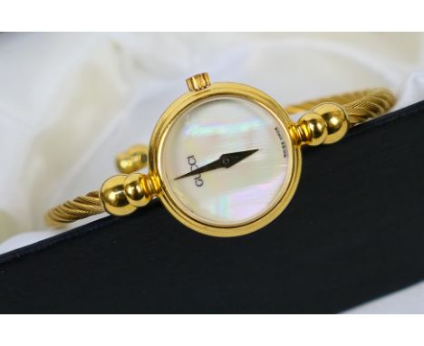 A Gucci bangle wristwatch, the circular mother of pearl dial with dauphine hands, marked to back 2700 2 L, number 0254918