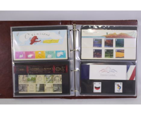 Philately - Two albums of Royal Mail Mint Stamp Presentation Packs, in excess of £420 face value. [2]