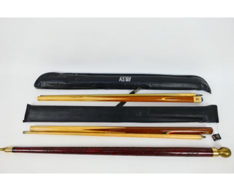 Three vintage pool cues comprising two Riley examples, both contained in cases and a pool cue walking stick.