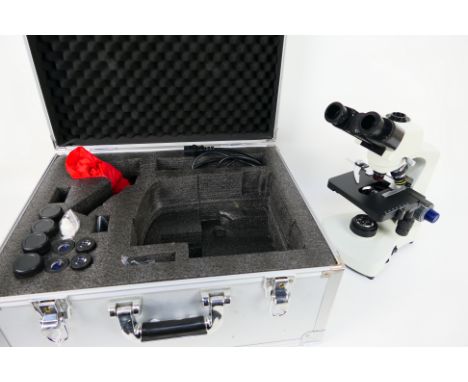 Apex Microscopes - A binocular biological microscope, model N-117M, contained in fitted trave case with cable and accessories