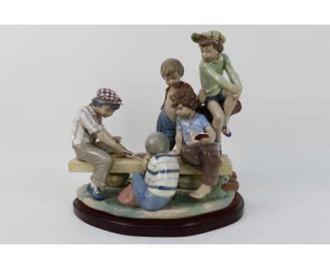 Nao by Lladro - a limited edition large and Impressive Porcelain Group Figure entitled Boys Playing Cards, sat on a wooden pl