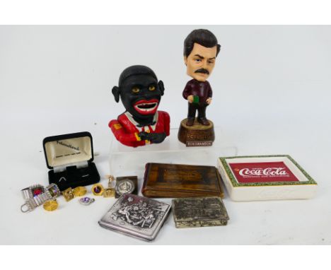 Lot to include a vintage cast iron money bank (reproduction), a bobblehead model of Ron Swanson, ceramic Coca Cola ashtray, S