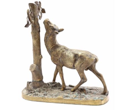 Copper statue of a deer near a tree trunk, 37 cm high