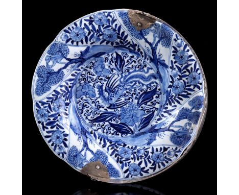 Porcelain pleated dish with silver handle and blue and white decor of phoenix in heart and monkeys in the rim and back richly