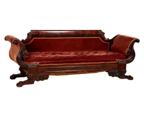 Antique mahogany sofa with red upholstery and richly carved decor of claw feet and cornucopia, Chippendale style, England ca.