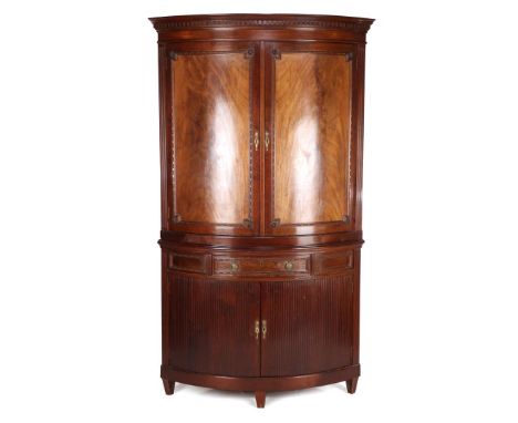 2-piece mahogany veneer corner cabinet with dentiles, w. 2 panel doors, drawer and 2 roller shutter doors, flanked by flutes 