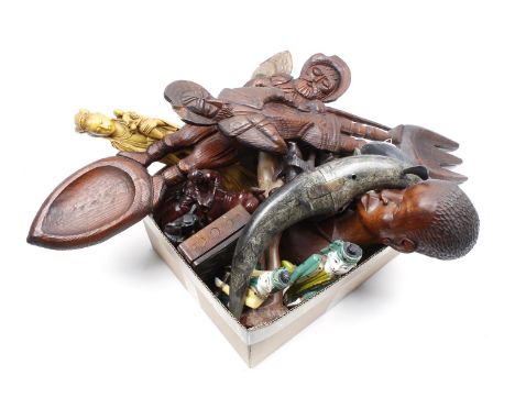 Box with various carvings, including statues from Indonesia and Africa, decorated horns from Indonesia, spoon and fork from S