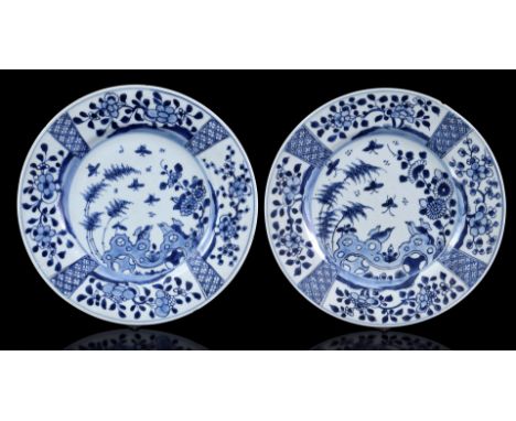 2 porcelain dishes with a blue and white decoration of butterflies and birds in a flower garden, marked on the back, China Ka