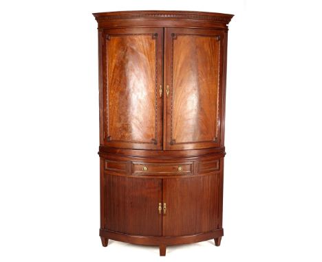 2-piece mahogany veneer corner cabinet with dentiles, w. 2 panel doors, drawer and 2 roller shutter doors, flanked by flutes 