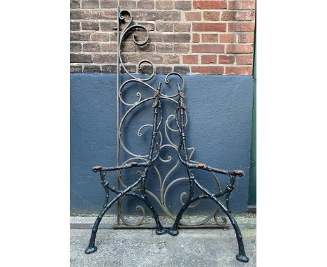 2 green lacquered cast iron sides of an old garden bench, 85 cm high and wrought iron ornament as part of the fencing, 131 cm