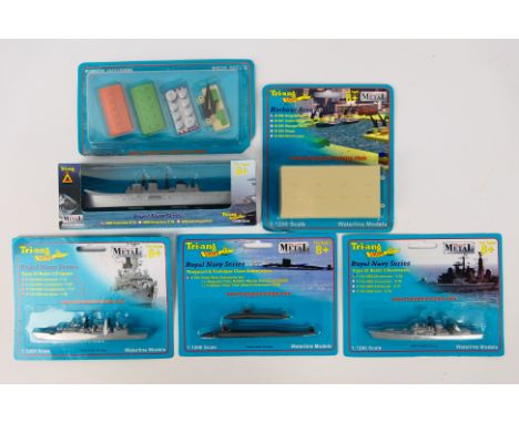 Tri-ang Waterline - A group of six boxed / carded Tri-ang Waterline 1:1200 scale diecast model ships and accessories includin