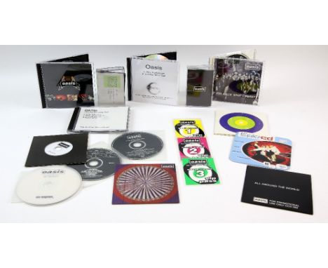 Oasis - 12 different promo singles and samplers including an interview CD with Noel from 12.1.97, ‘Columbia’ 2004 promo CD, 4