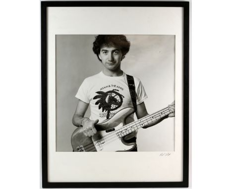 Queen - An original silver gelatin exhibition print - portrait of John Deacon, bass guitarist in Queen, with his ‘Under Press