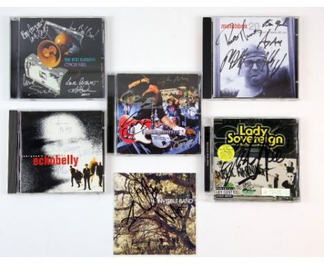 CD albums signed by The International Swingers featuring Glen Matlock and Clem Burke, Travis, The Boo Radleys, Echobelly, Mat