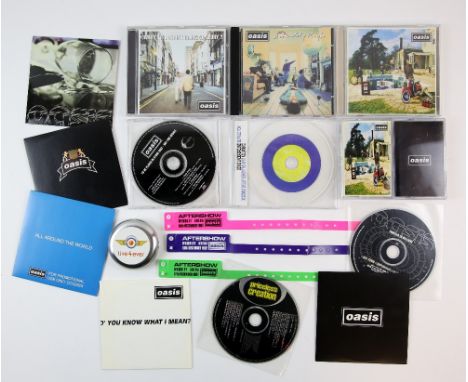 Oasis - 12 different promo singles samplers and albums including the first 3 original Creation Records albums, ‘Be Here Now’ 