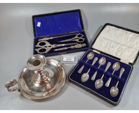 Cased set of six silver teaspoons 1.7 troy oz. approx., together with a silver-plated chamber candlestick and an ornate Victo