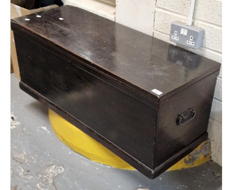 Vintage stained pine trunk with fitted candle box and cast metal loop carrying handles (B.P. 21% + VAT) 