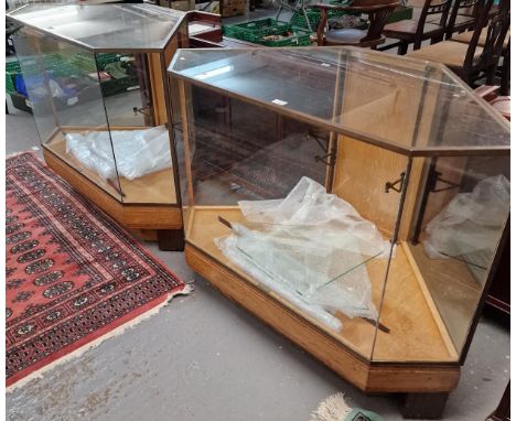 Pair of oak Art Deco haberdashery cabinets by Pollards of London, with glazed shelves and bronze mouldings. 118x61x92cm appro