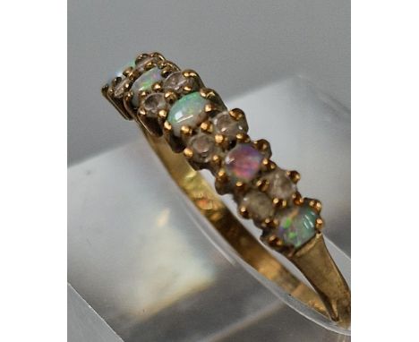 9ct gold thirteen stone opal and clear stone ring. 1.4g approx. Size M.  (B.P. 21% + VAT) 
