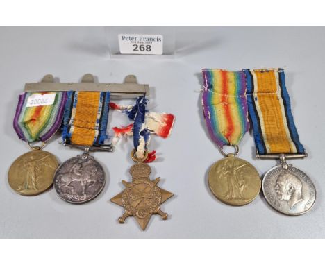 Two First World War medal groups to include: Medal trio awarded to Private W. John AOC number 010548 to include 1914-1915 Sta