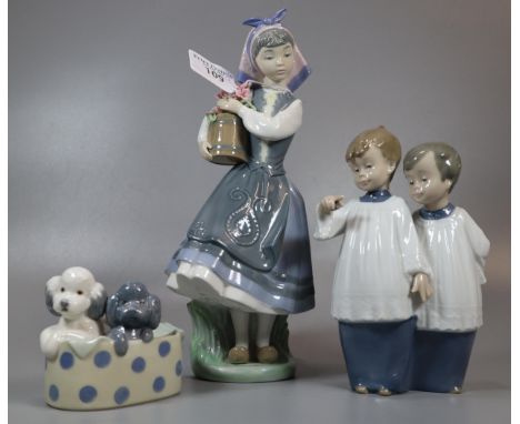 Lladro Spanish porcelain figurine of a young girl with bucket of flowers together with two Nao Spanish porcelain figure group
