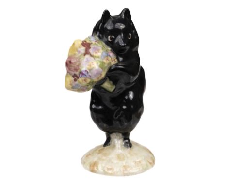 * Beswick. Duchess with Flowers, from Beatrix Potter, pottery figurine, depicting a black dog holding a bunch of flowers, gol