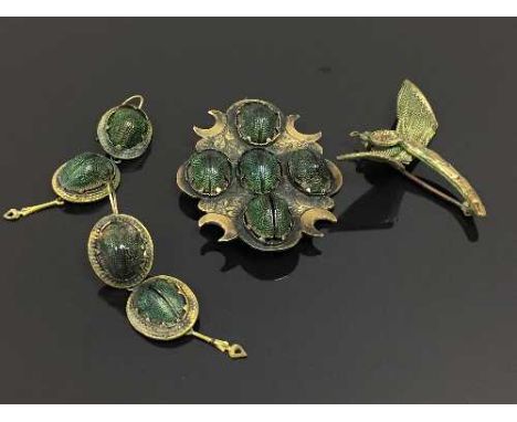 A 1920's Art Deco period scarab beetle brooch, together with the matching pair of earrings and a dragonfly brooch. (4) CONDIT