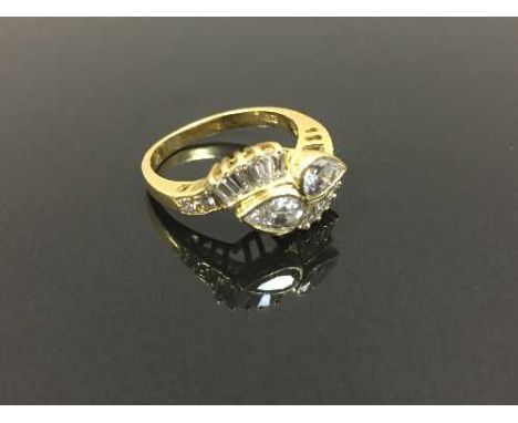 An 18ct gold diamond cluster ring set with baguette and pear cut diamonds, size K. CONDITION REPORT: Good conditions.