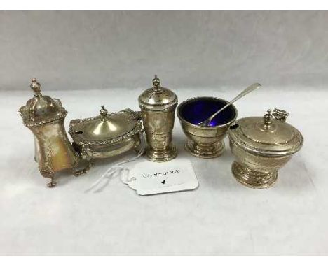 A group of five early twentieth century silver condiment vessels. (5) CONDITION REPORT: The lot comprises of cylinderical pep