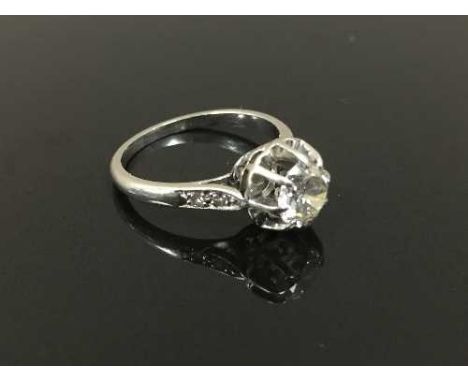 A platinum solitaire diamond ring, with diamond shoulders,  approximately 0.85ct, size K. CONDITION REPORT: Good condition, c