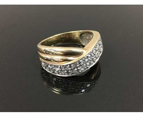 A 9ct gold cross-over ring, size S. CONDITION REPORT: Good condition, set with cubic zirconia.