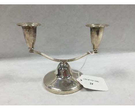 A silver double candlestick, Birmingham 1966, height 10.5 cm, 195.6g. CONDITION REPORT: Good condition, loaded base, gross we