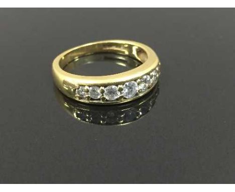 An 18ct gold diamond half eternity ring, size J/K. CONDITION REPORT: Good conditions.